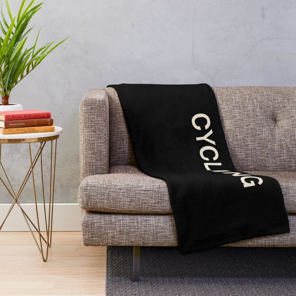 Cycling plush blanket featuring a bicycle design