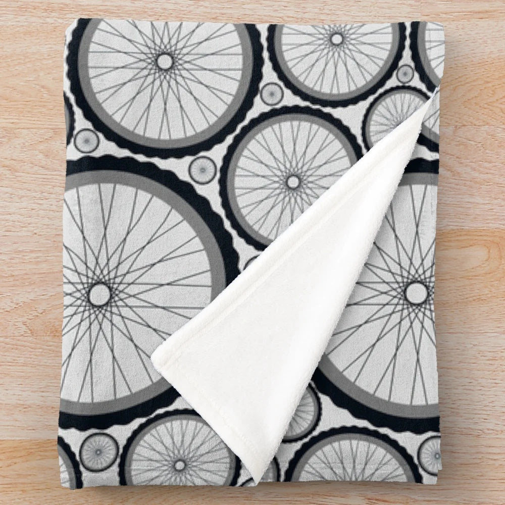 Cycling-themed plush blanket