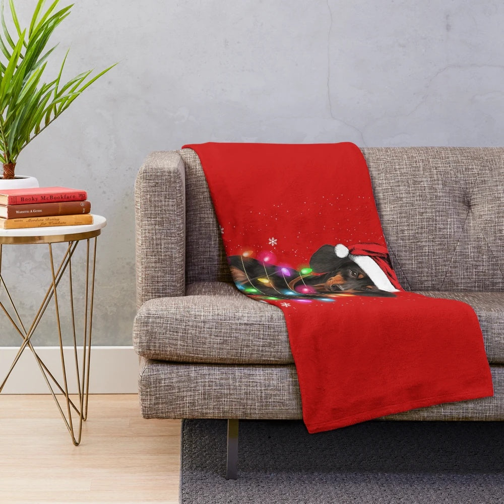 Dachshund plush blanket with Christmas lights and snow sweater design