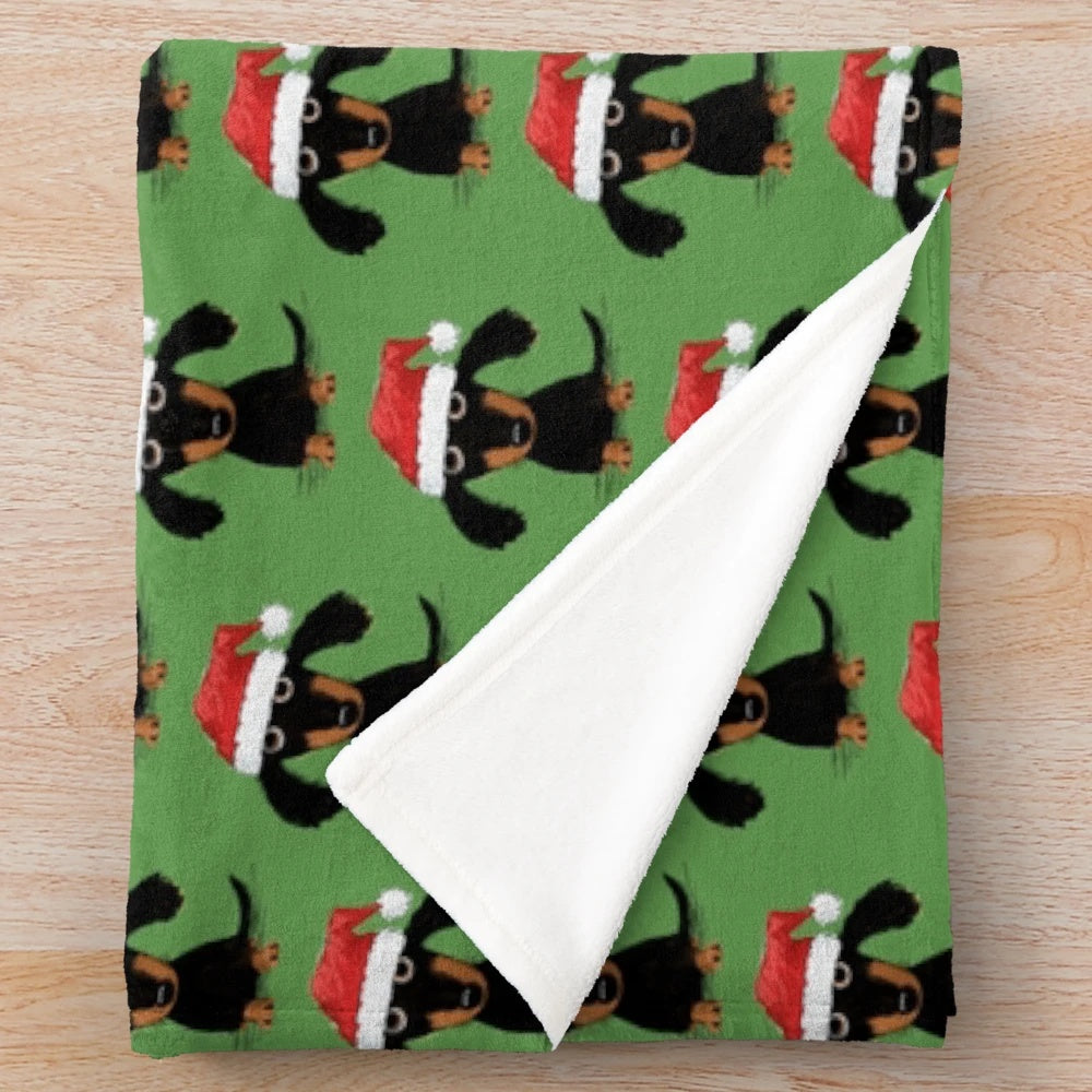 Dachshund plush blanket with santa hat and holiday design