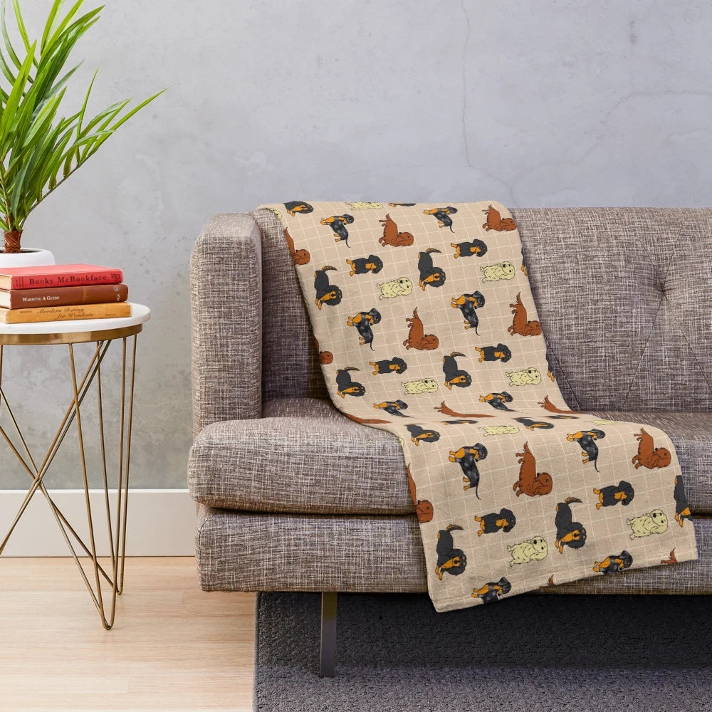 Cream colored plush blanket with a dachshund dog design
