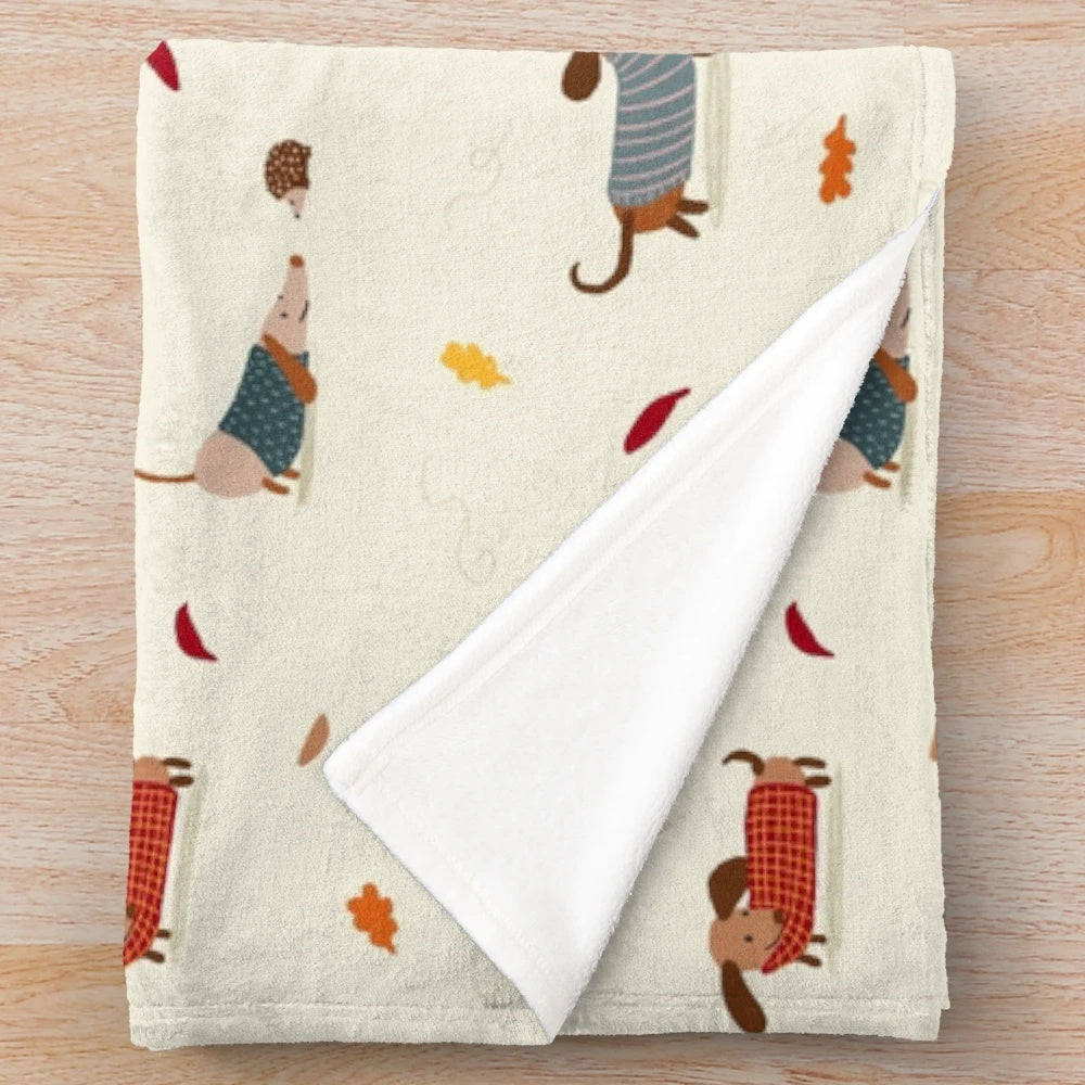 Dachshund plush blanket with autumn leaves and winter sweaters