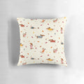 Cute dachshund wearing a winter sweater surrounded by autumn leaves on a decorative pillow