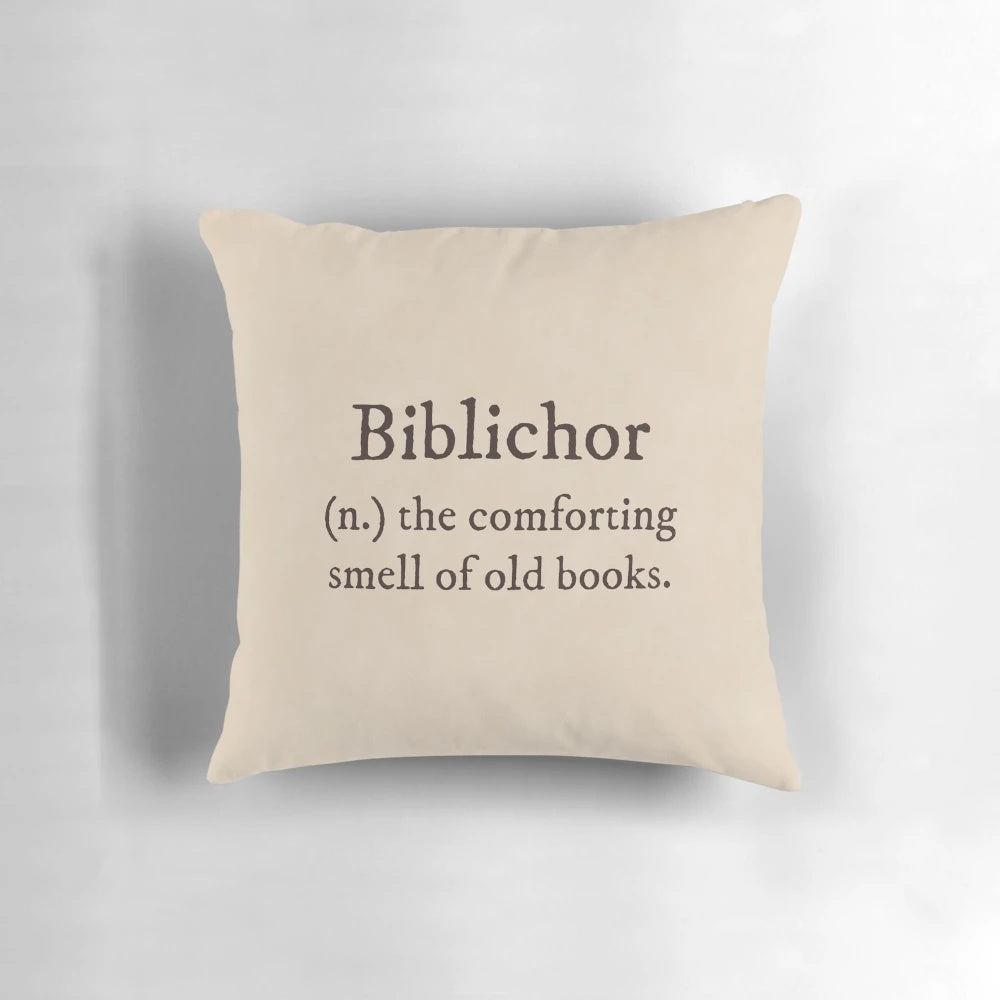 Dark academia-themed pillow with "Biblichor Definition" text