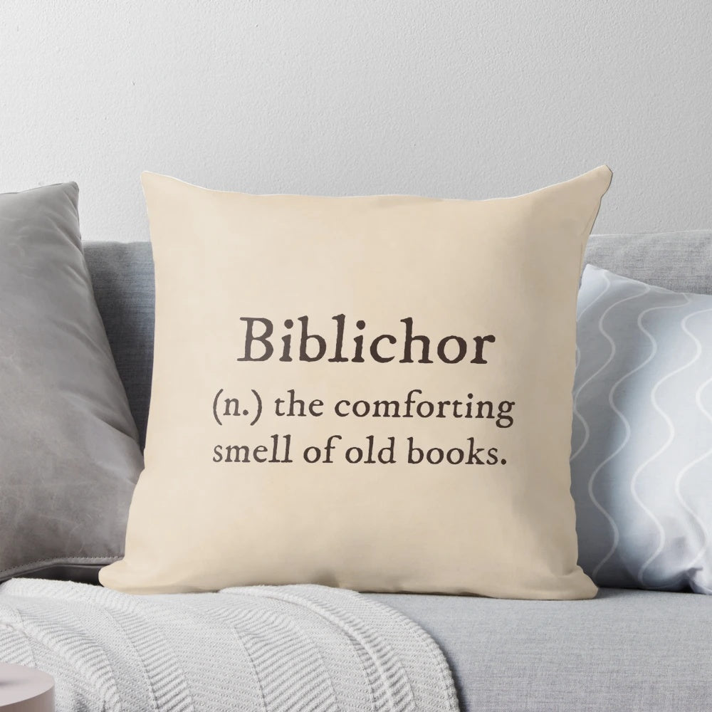 Dark academia-themed pillow with "Biblichor Definition" text