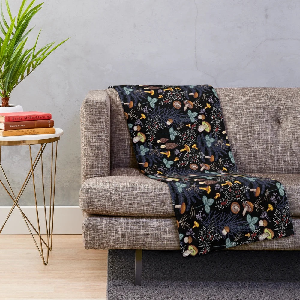 Plush blanket with a dark forest mushroom pattern
