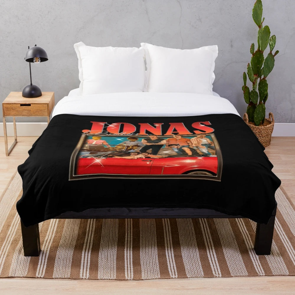 Dark green plush blanket with Jonas Brothers design