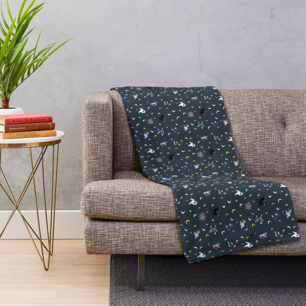 Dark plush blanket with crescent moon design