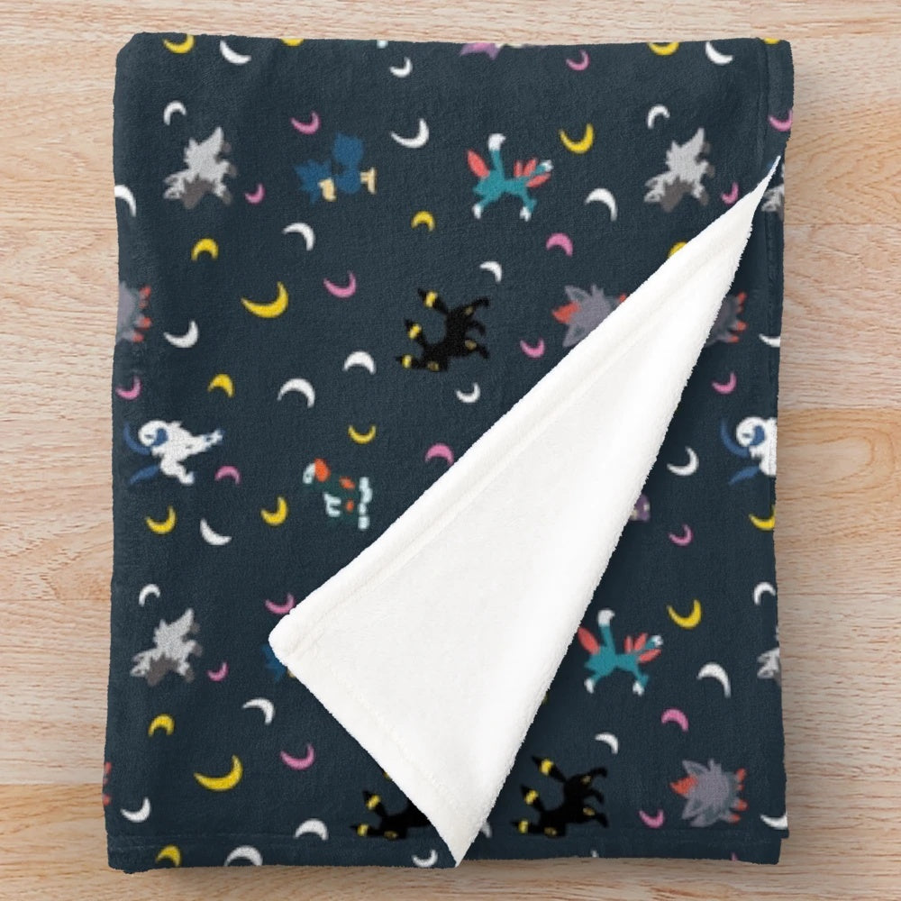 Dark plush blanket with crescent moon design