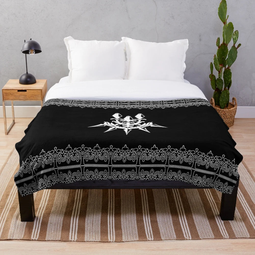 Dark plush blanket with machine-inspired, futuristic design