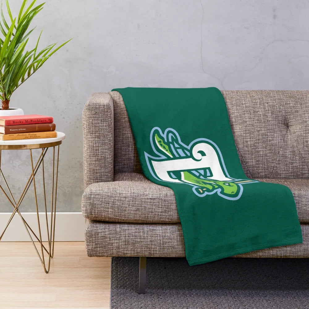 A soft and plush blanket featuring the Daytona Tortugas logo and team colors