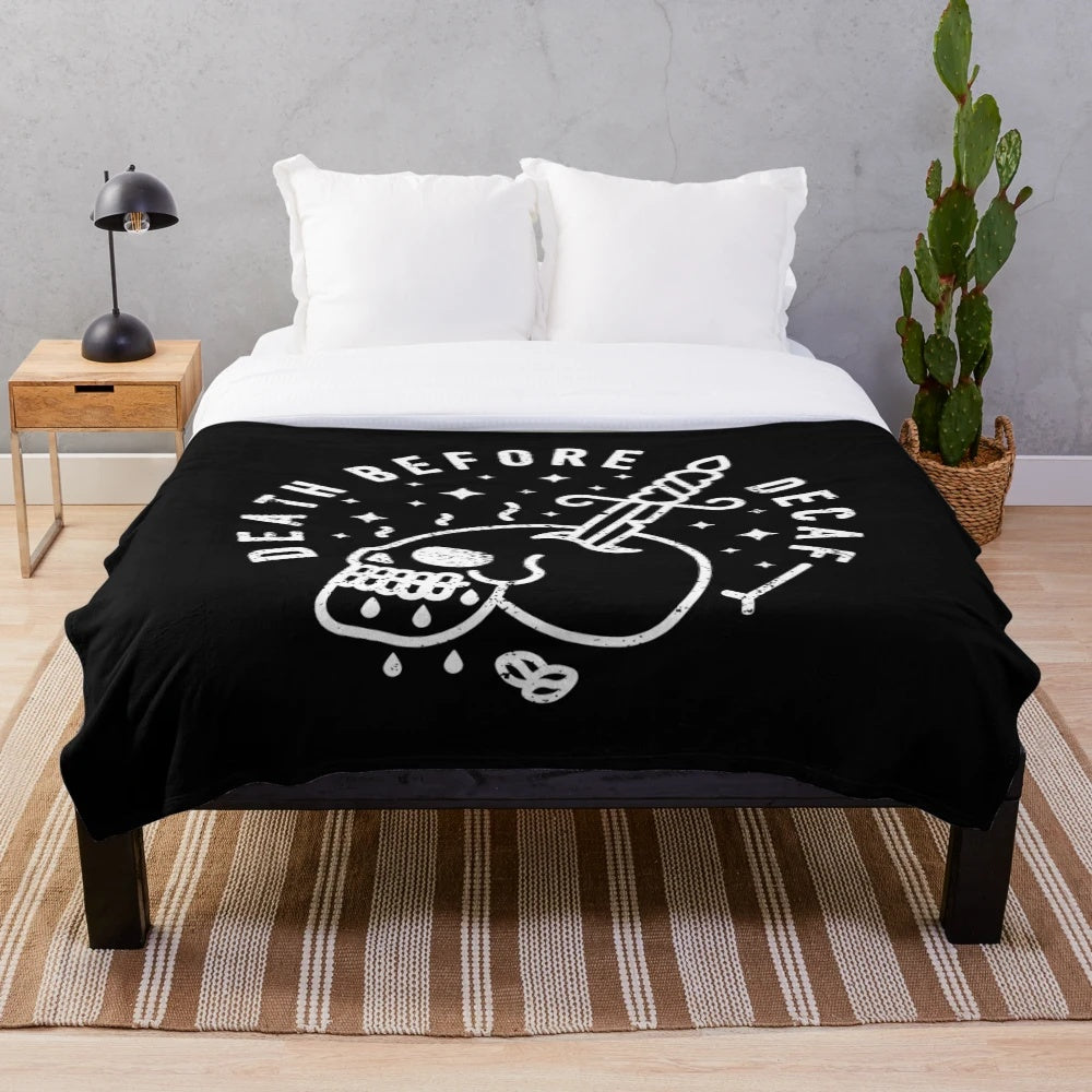 Death Before Decaf" plush blanket featuring a skull and coffee design