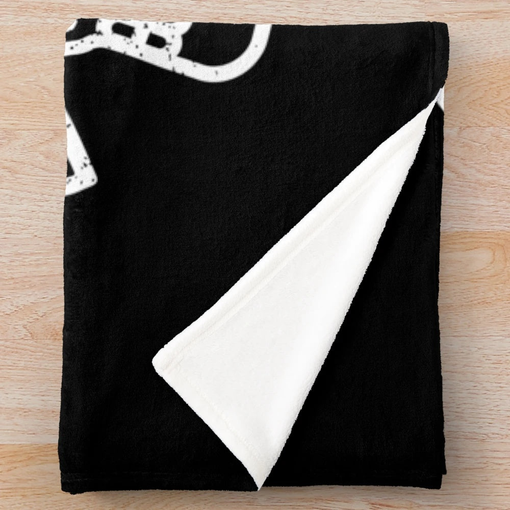 Death Before Decaf" plush blanket featuring a skull and coffee design