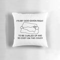 A cozy decorative pillow featuring a pixel art design of a cat on a couch.
