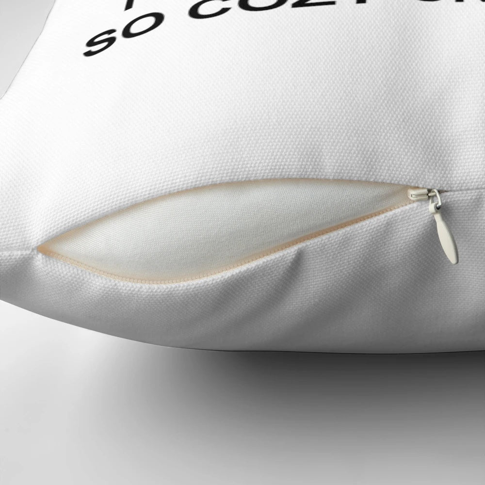 A cozy decorative pillow featuring a pixel art design of a cat on a couch.
