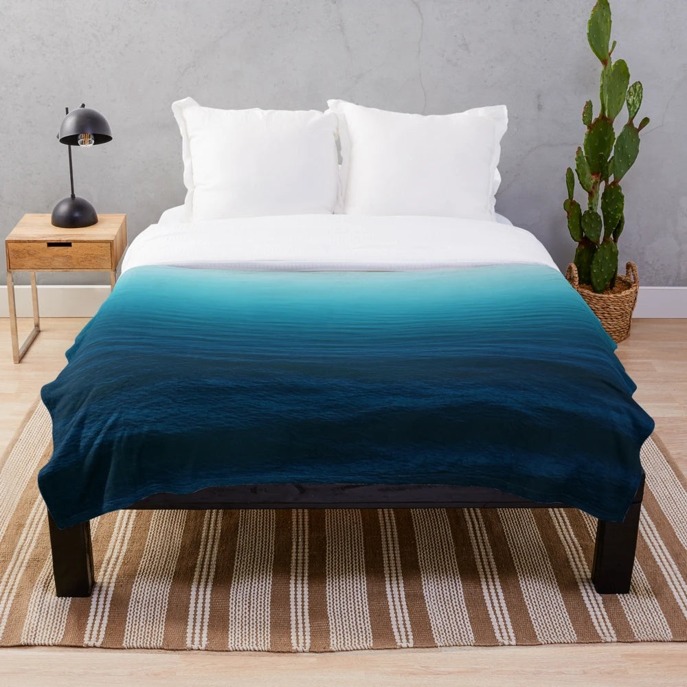 Deep blue plush blanket with ocean waves design