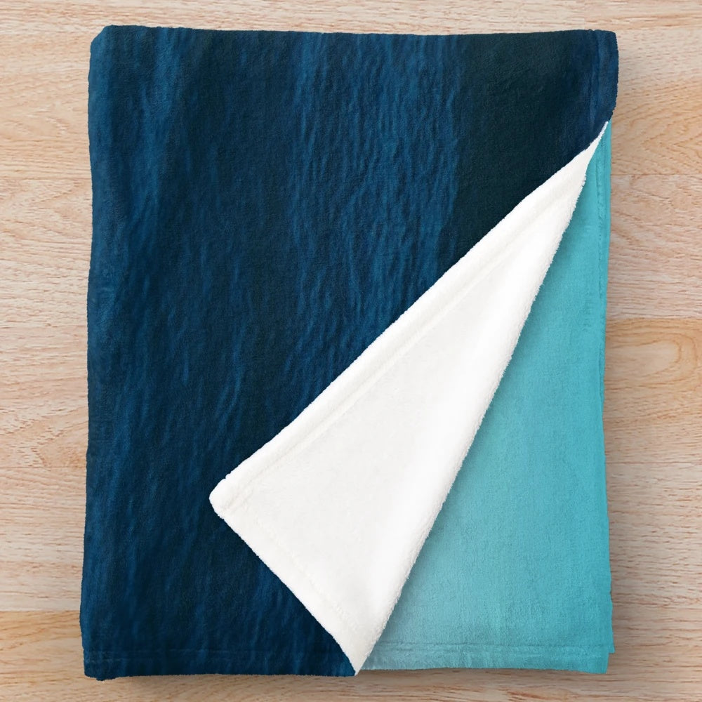 Deep blue plush blanket with ocean waves design