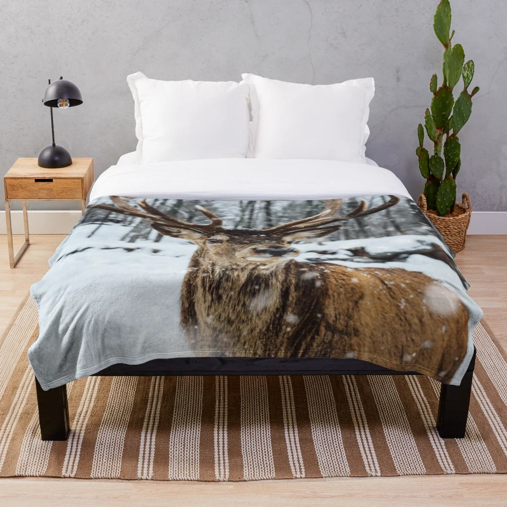 Deer in a snowy winter landscape on a plush, cozy blanket