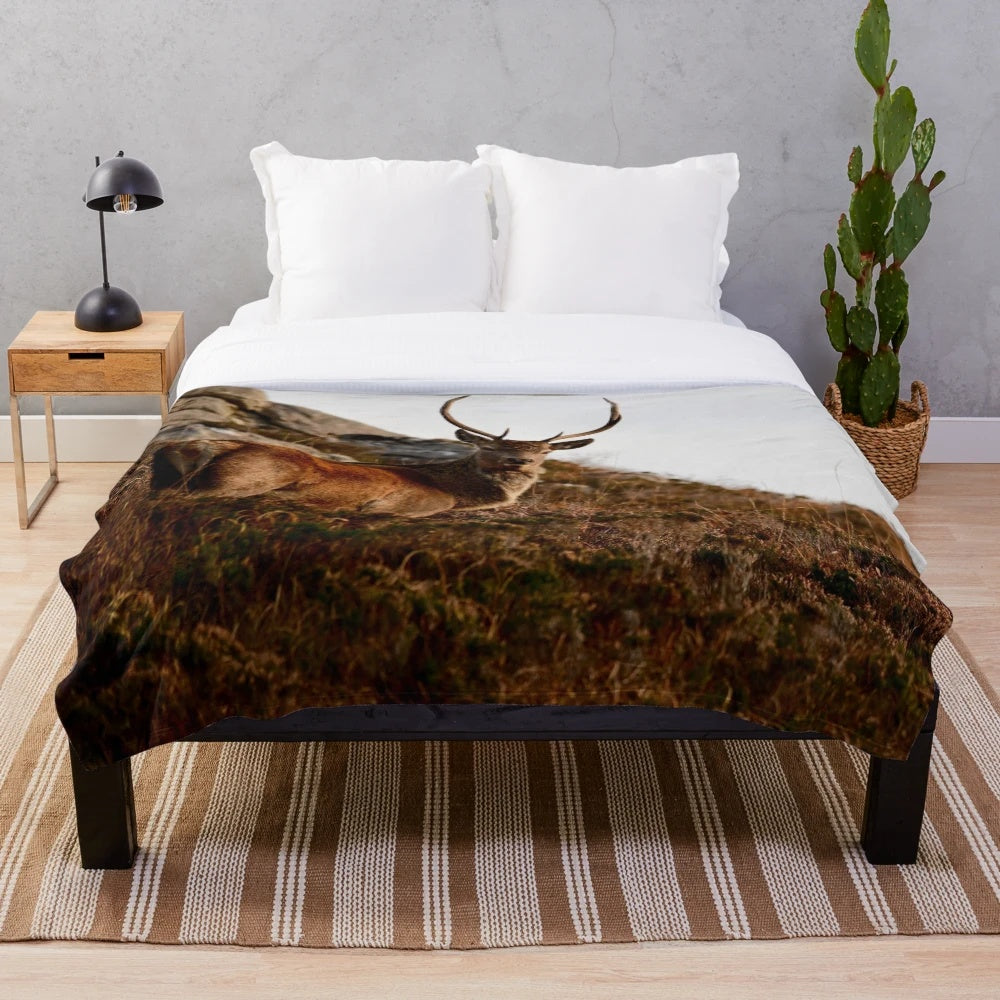Cozy plush blanket featuring a deer watching scene in the Scottish Highlands