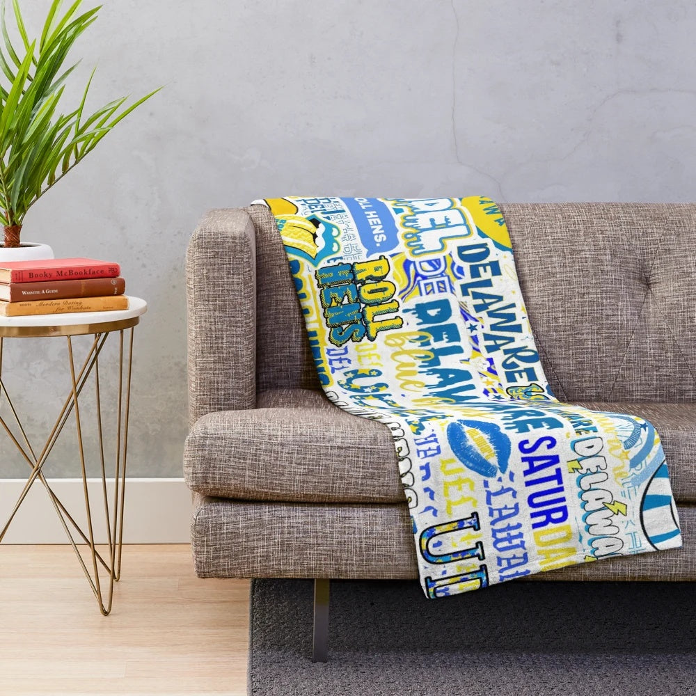 Soft and plush blanket featuring a collage design inspired by the University of Delaware and the Blue Hens mascot.