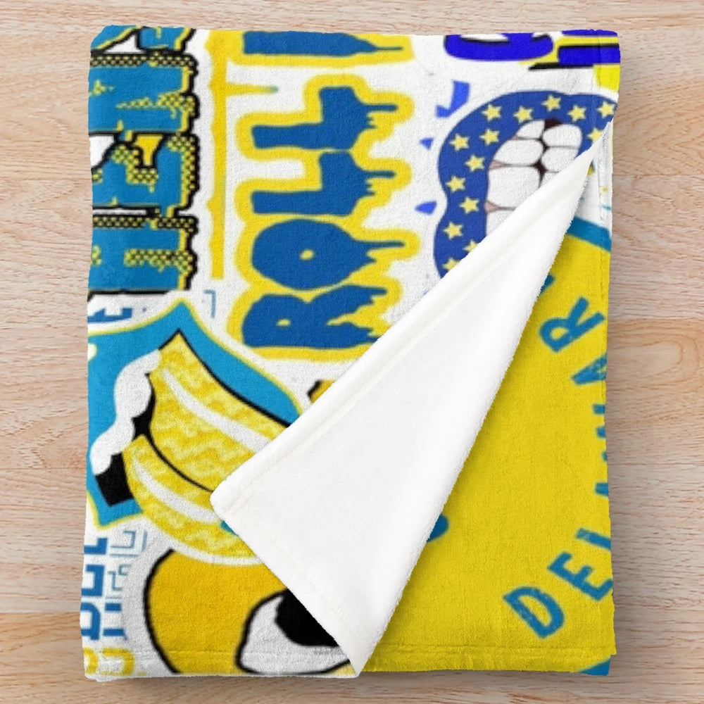 Soft and plush blanket featuring a collage design inspired by the University of Delaware and the Blue Hens mascot.