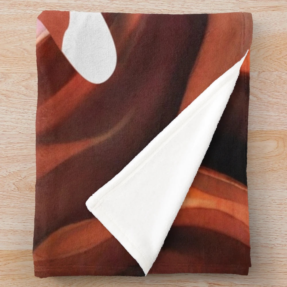 Plush blanket featuring a desert fox illustration in brown and red tones