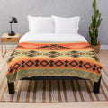A plush and cozy blanket featuring a beautiful native american-inspired tribal pattern design.