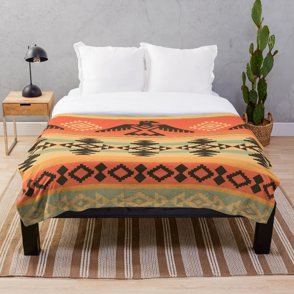 A plush and cozy blanket featuring a beautiful native american-inspired tribal pattern design.