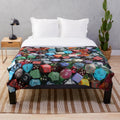 Plush dice-themed blanket for tabletop gaming enthusiasts