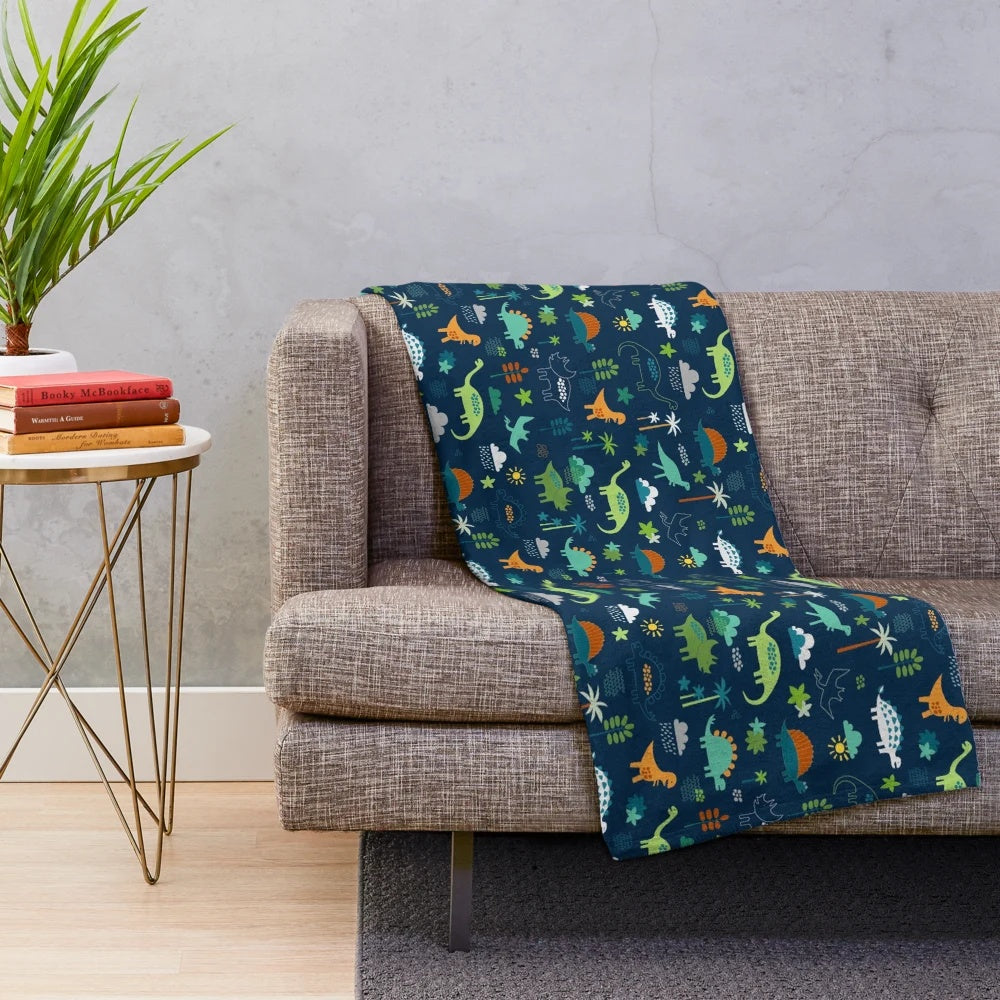 Dinosaur Land plush blanket featuring a cute dino pattern design