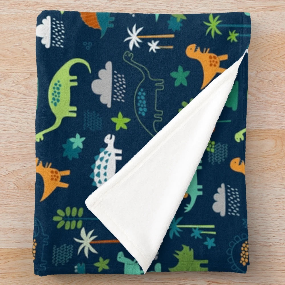 Dinosaur Land plush blanket featuring a cute dino pattern design