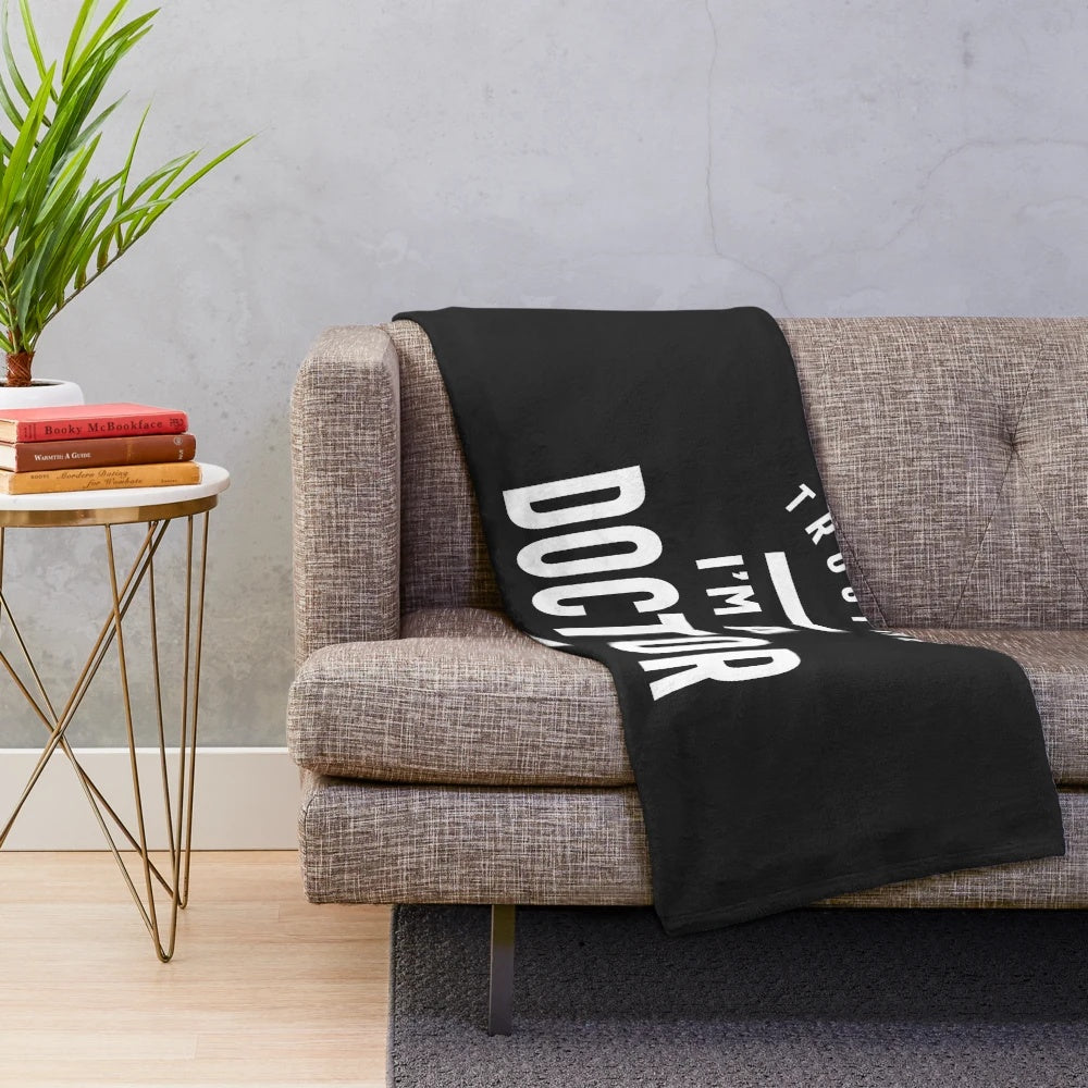Plush blanket with doctor-themed design