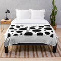 Soft, plush blanket with a charming dog pattern design