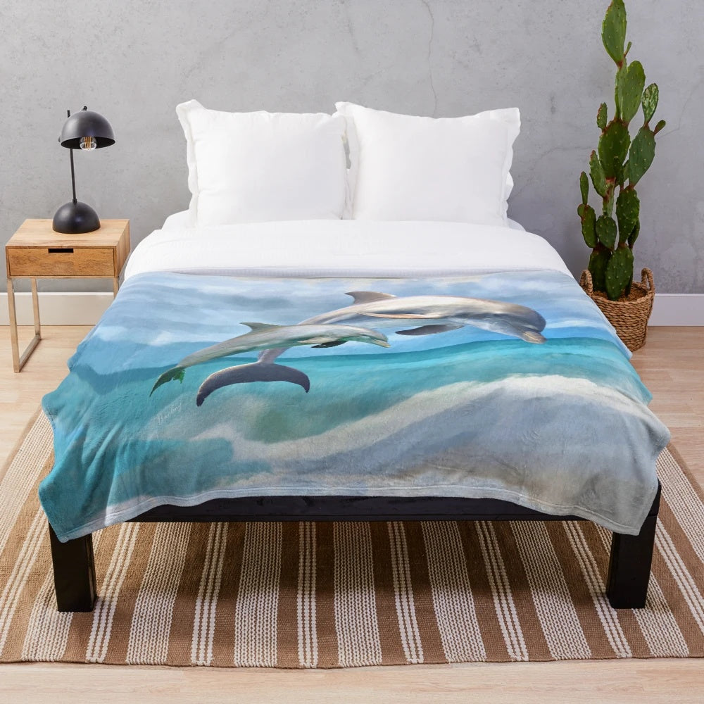 Colorful plush blanket featuring playful dolphins swimming in the ocean