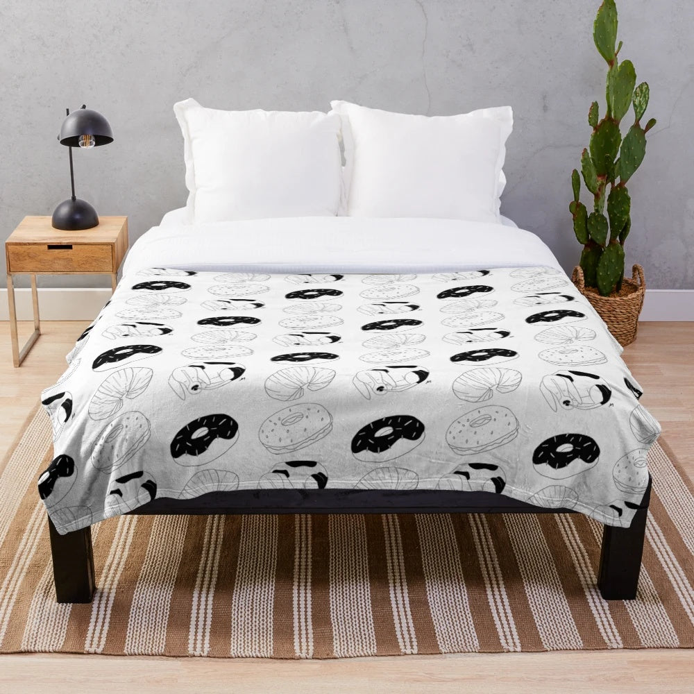 Donut-shaped plush blanket for dogs featuring a sleeping hound dog curled up