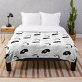 Donut-shaped plush blanket for dogs featuring a sleeping hound dog curled up