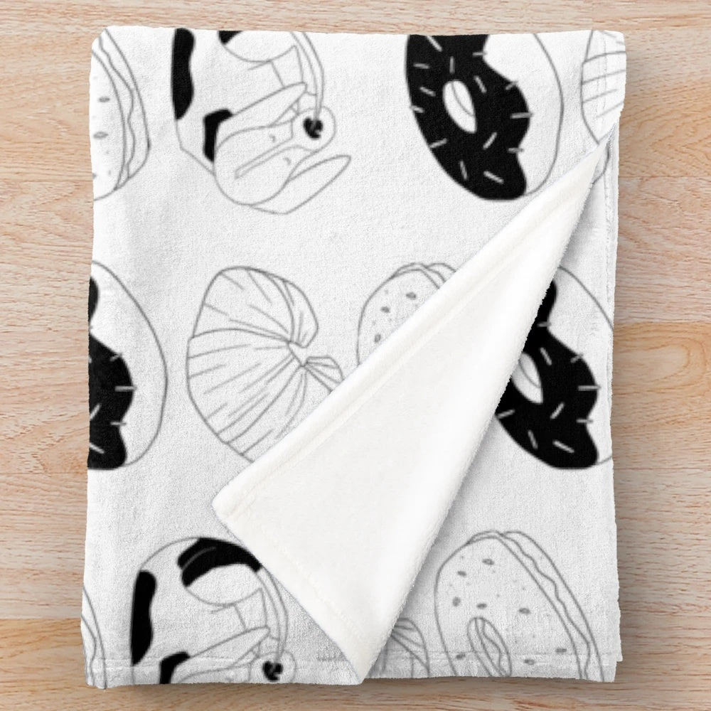 Donut-shaped plush blanket for dogs featuring a sleeping hound dog curled up