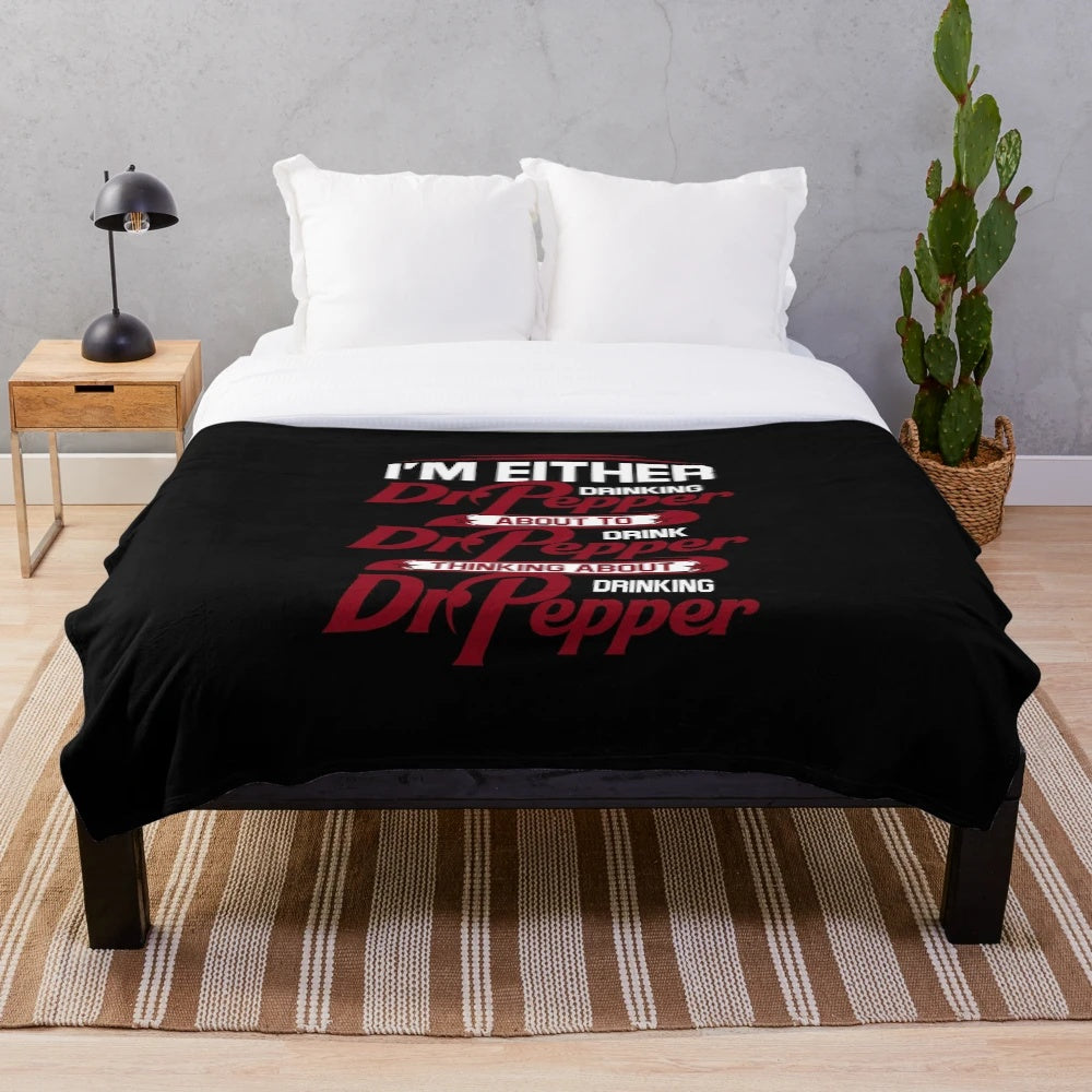 Soft and plush blanket with a humorous "I'm Either Drinking Dr. Pepper About to Drink Dr. Pepper" design, perfect for soda enthusiasts.
