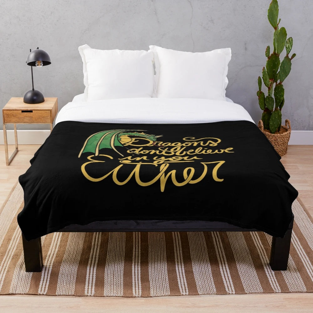 Plush dragon-themed blanket with a whimsical design