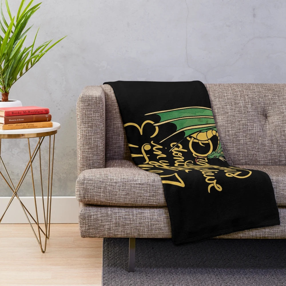 Plush dragon-themed blanket with a whimsical design