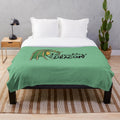 Plush dragon-themed blanket with green and blue accents