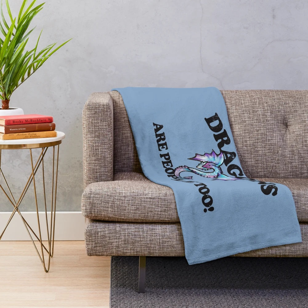 A cozy purple and blue dragon-themed plush blanket for fantasy and nerd enthusiasts.