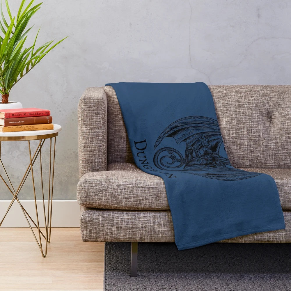 Dungeons and Dragons plush blanket featuring dice, dragons, and other fantasy elements