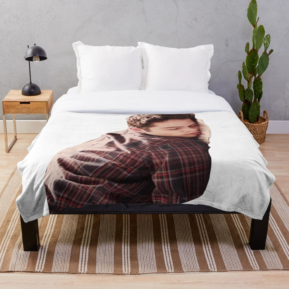 Soft, cuddly plush blanket featuring a cute image of actor Dylan O'Brien