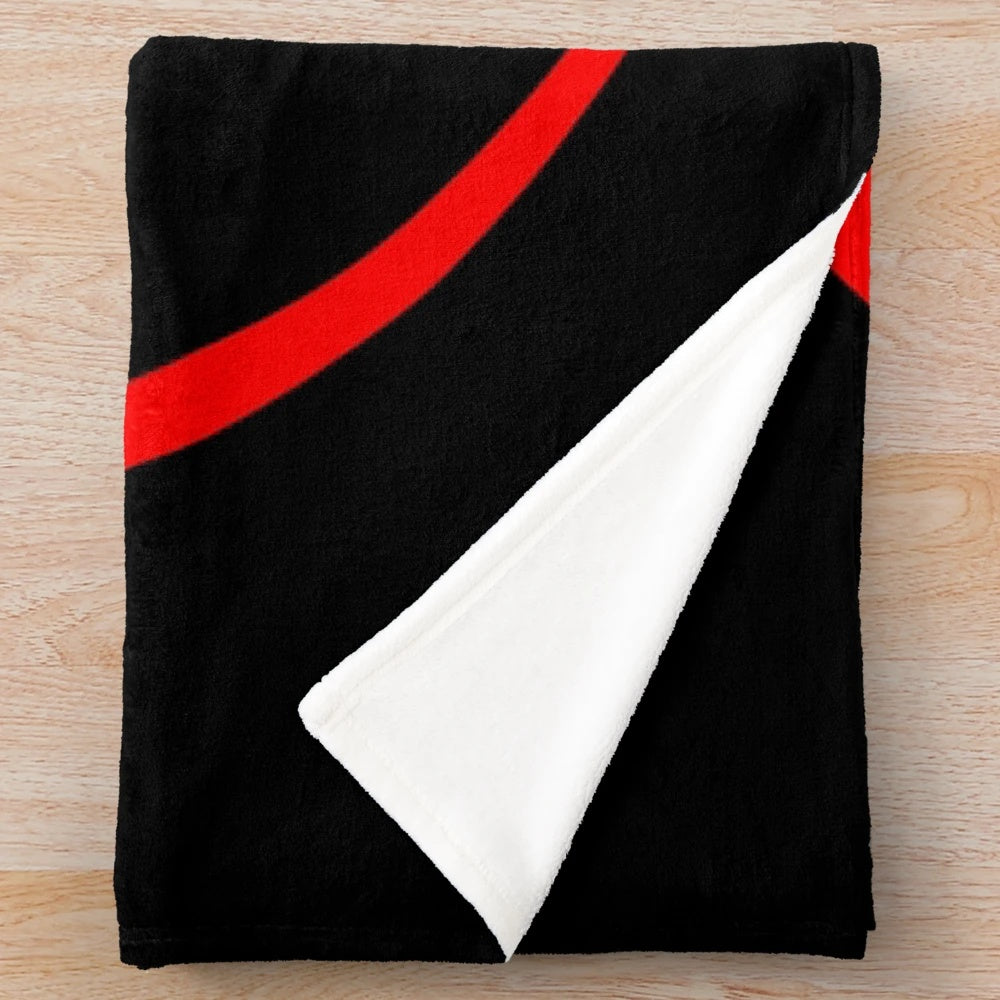 Cozy plush blanket in red and blue with an eclipse design