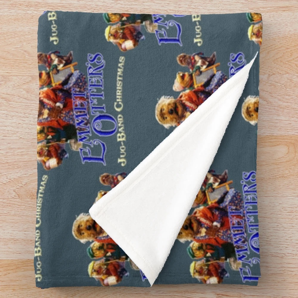Emmet Otter's Jug Band Christmas plush blanket featuring a cute otter in a holiday setting