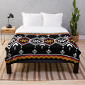 Plush blanket with ethnic Navajo-inspired seamless pattern