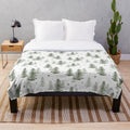 Soft and plush evergreen-patterned blanket for cozy winter nights