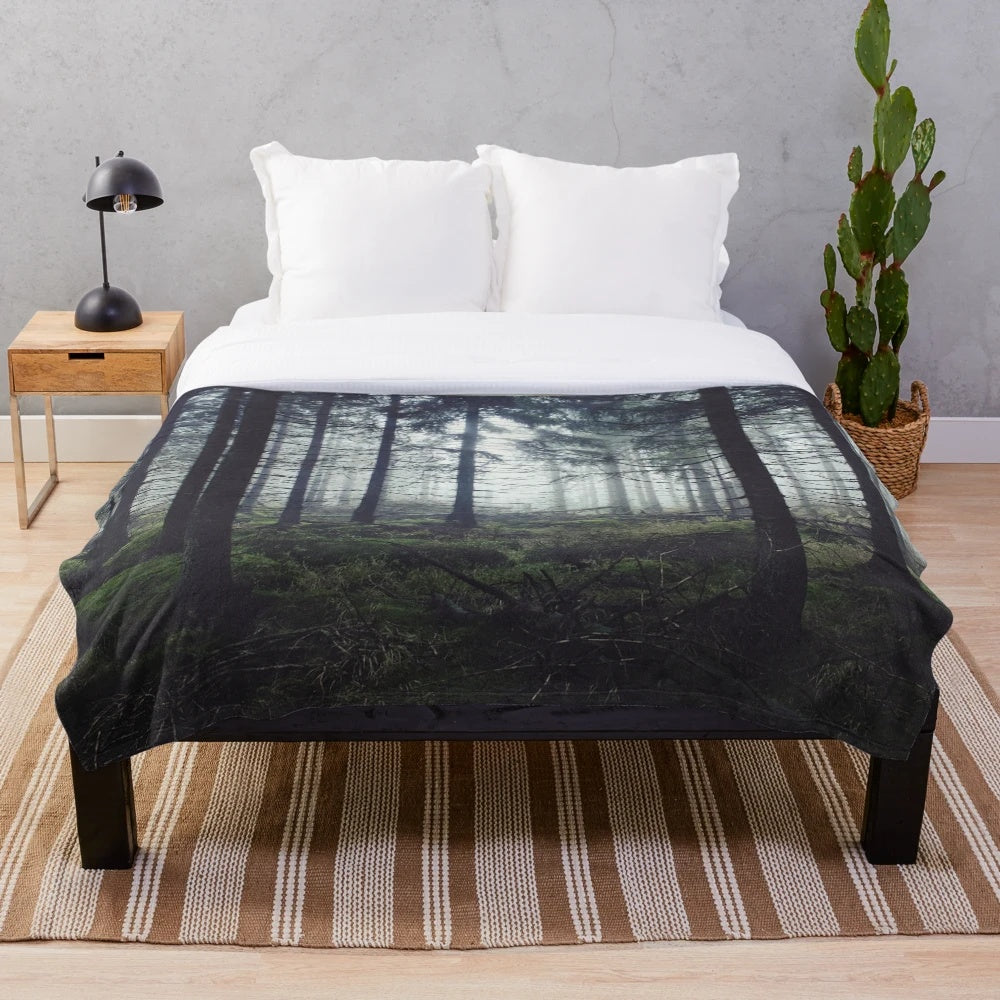 Plush blanket featuring a fairytale forest landscape with misty, enchanted woods