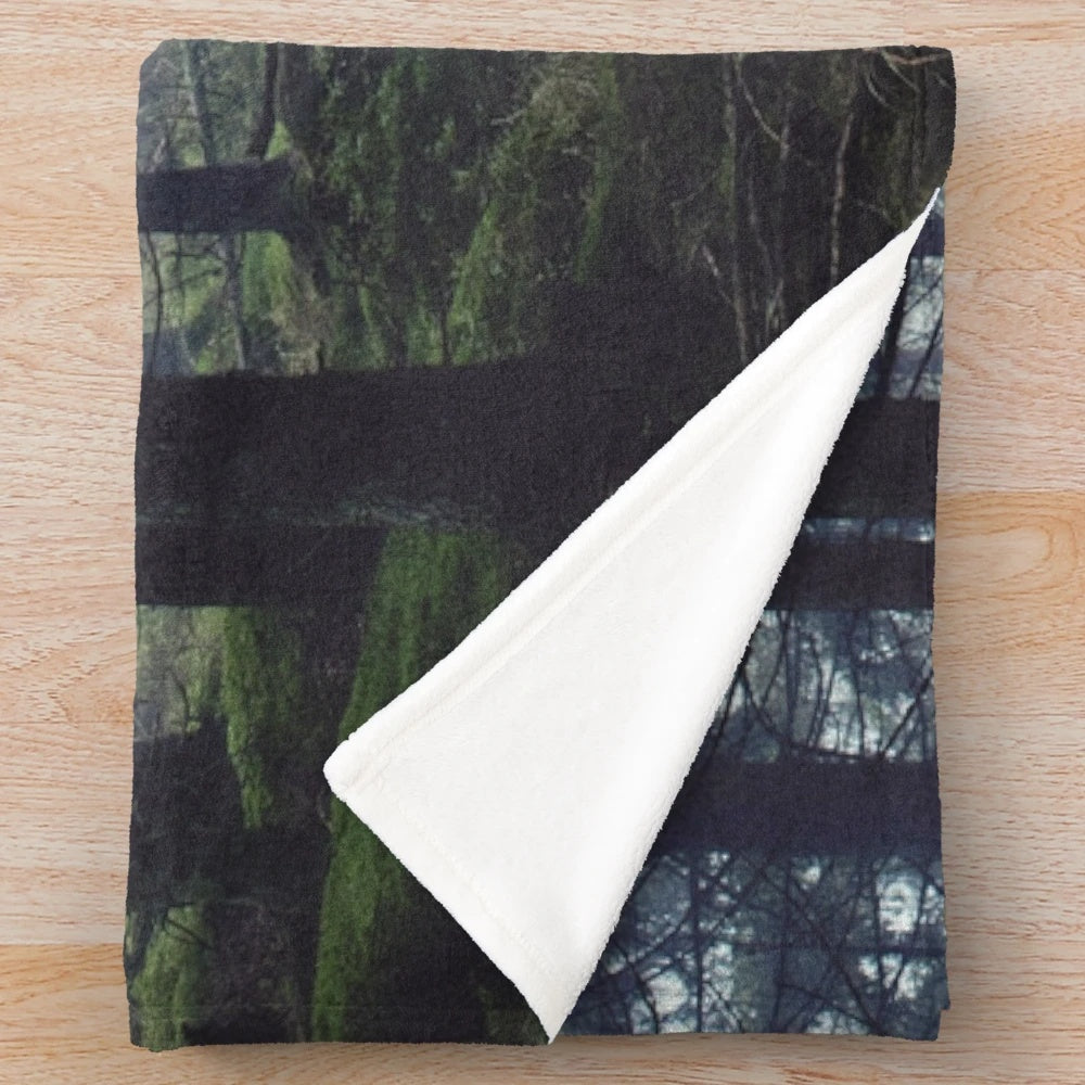 Plush blanket featuring a fairytale forest landscape with misty, enchanted woods